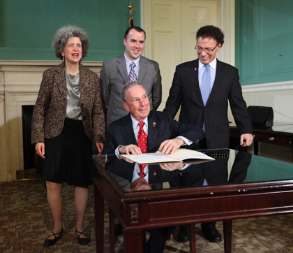 Dr. Karen Gourgey, Lester Marks, and Councilmember James Vacca join Mayor Bloomberg at the bill signing